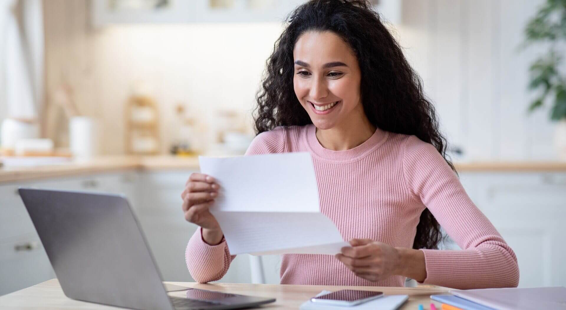 portrait-of-excited-happy-woman-reading-letter-in-2021-09-02-05-09-24-utc (1) (1)